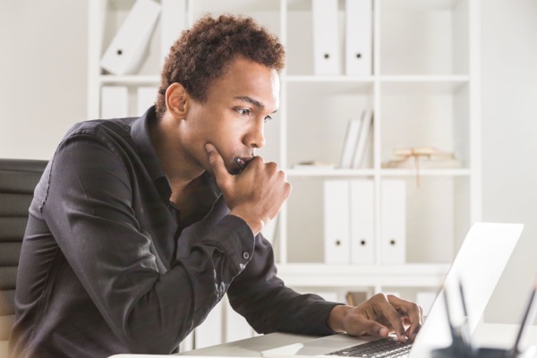 man working on a project at computer