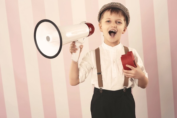 You boy talking into a megaphone